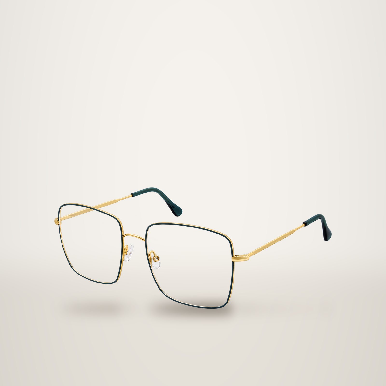 Monture de lunettes carrée en métal doré avec contour vert foncé et embouts verts, photographiée sur fond blanc.